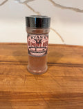 Shaker with 'Ryan's 10 Point Rum' label on a wooden surface